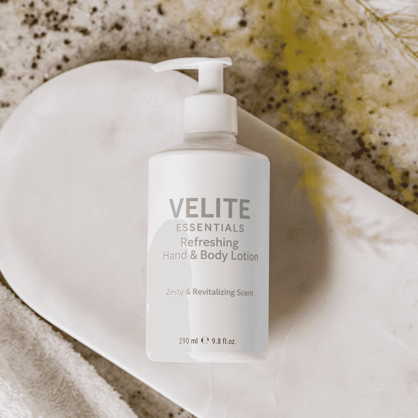 Velite Essentials Lotion - Vegan Hand Body Care placed on marble tray with towel, styled for a spa-like skincare experience.