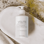 Velite Essentials Lotion - Vegan Hand Body Care placed on marble tray with towel, styled for a spa-like skincare experience.