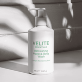 Velite Essentials Citrus Fresh Body Wash in natural light with shadows, emphasizing its ECOCERT-certified, vegan skincare appeal for soft, refreshed skin.