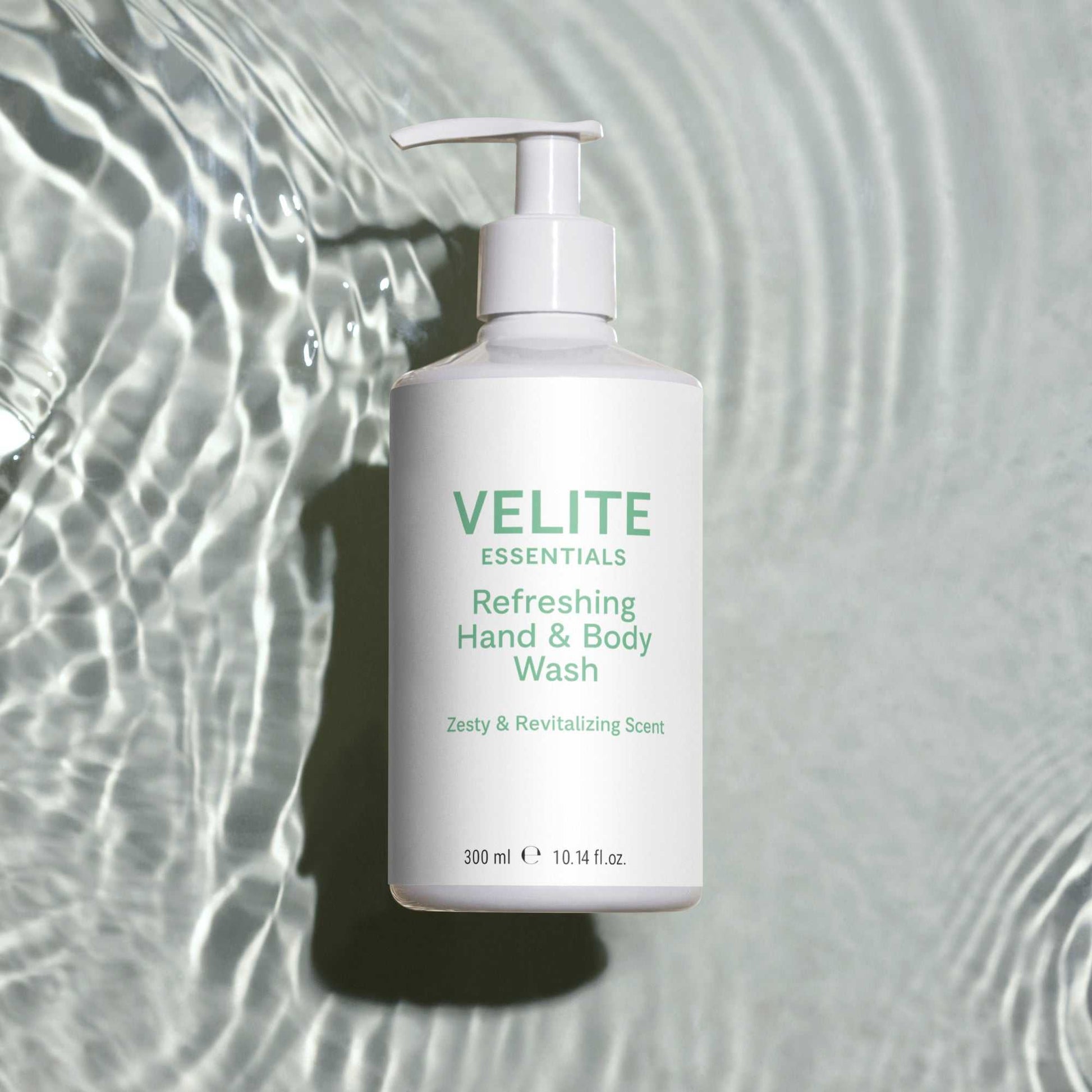 Velite Essentials Citrus Fresh Body Wash on rippling water background, highlighting its hydrating and vegan-friendly formula for daily cleansing.