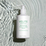Velite Essentials Citrus Fresh Body Wash on rippling water background, highlighting its hydrating and vegan-friendly formula for daily cleansing.