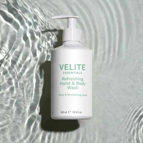 Velite Essentials Citrus Fresh Body Wash on rippling water background, highlighting its hydrating and vegan-friendly formula for daily cleansing.