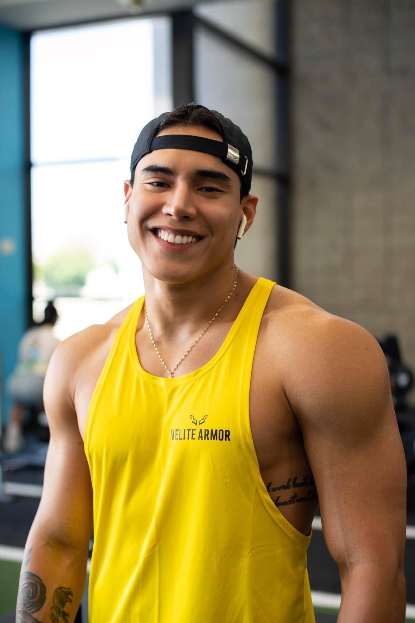 Yellow Booster Athletic Wear tank top by Velite Armor, shown in close-up with breathable fabric ideal for active workouts and gym sessions.