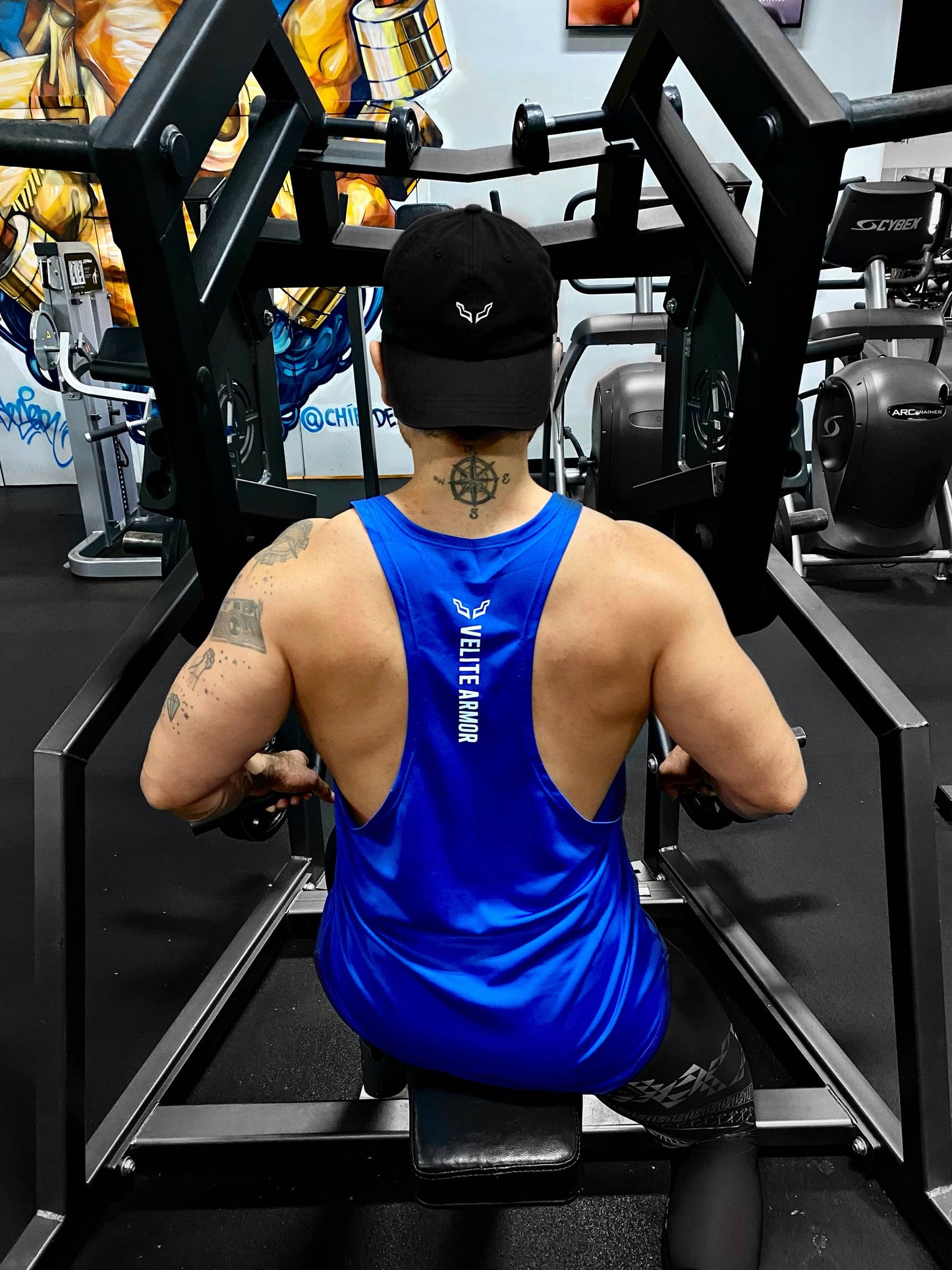 Back view of Royal Booster Velite Armor tank top in blue, showcasing racerback design and breathable fabric ideal for intense gym workouts.